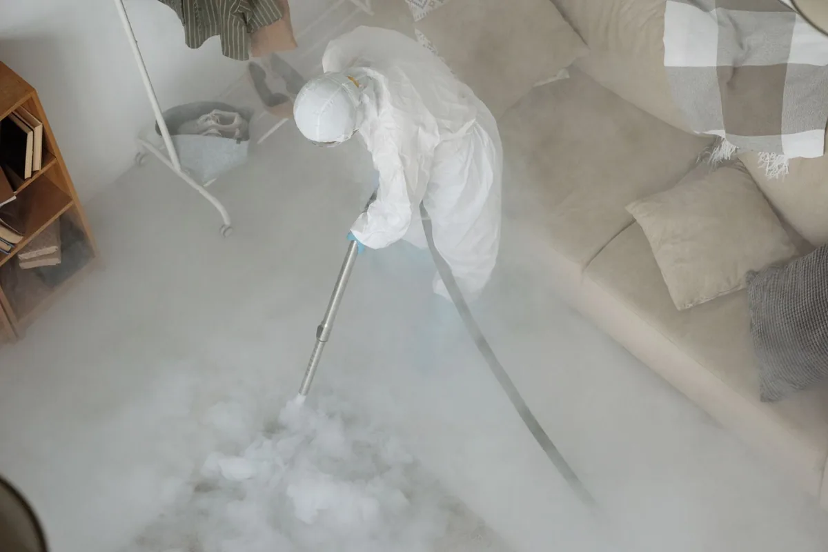 Biohazard cleanup technician in protective equipment, Springwells, Detroit, MI